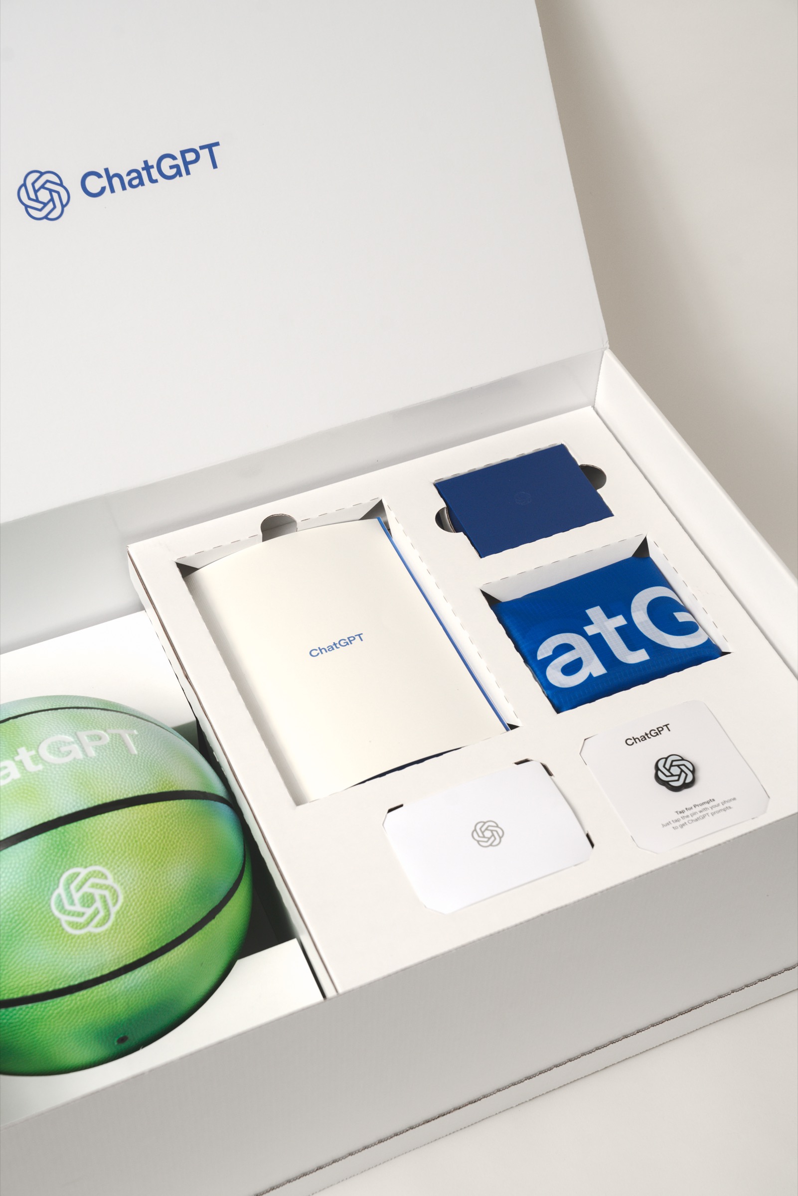 Official ChatGPT swag box with a basketball and fitted accessory compartments